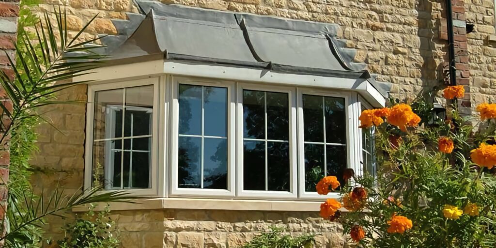 aluminium bay windows triple glazing white frame stone house exterior glazing options trinity windows jersey 2500