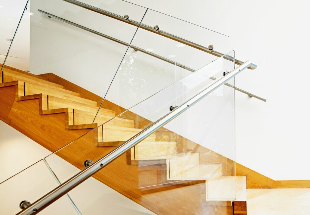 glass balustrade with stainless steel handrail on wooden staircase glass balustrades trinity windows jersey 2500