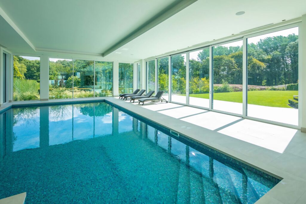 technal confort160 floor to ceiling sliding doors indoor pool view trinity windows jersey 2500