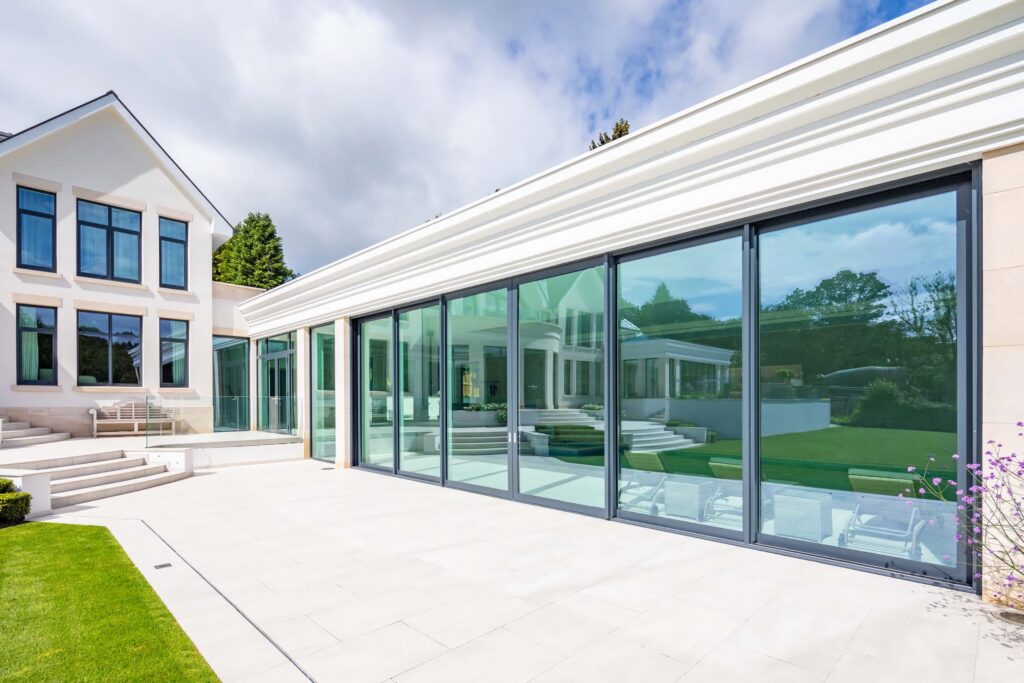 technal confort160 large sliding doors modern mansion exterior trinity windows jersey 2500
