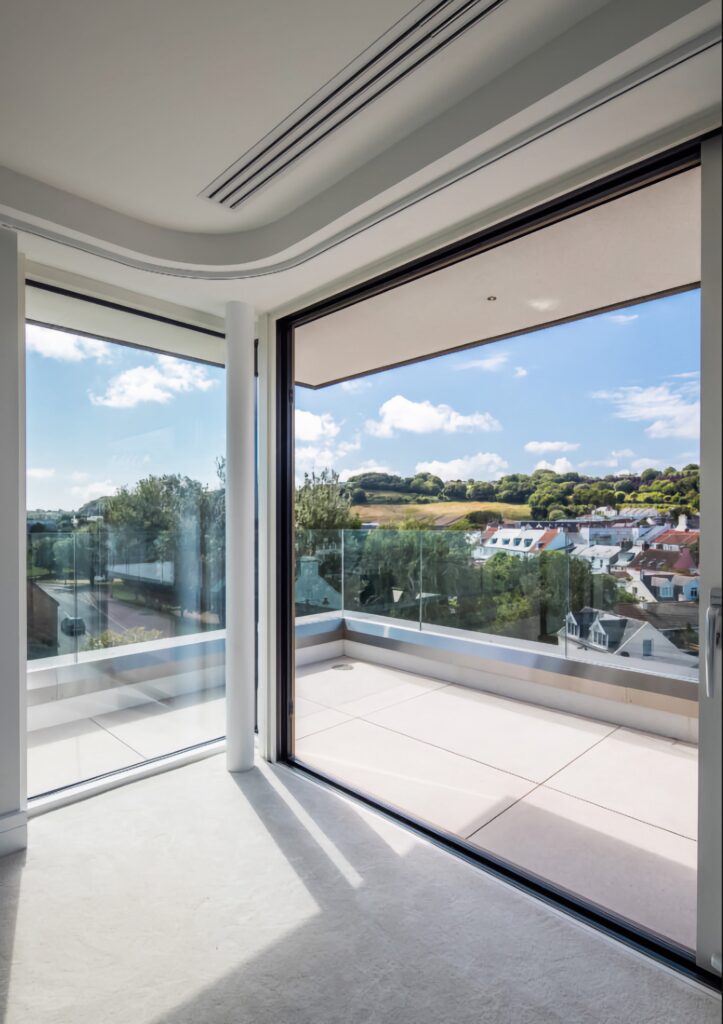 technal confort160 sliding door balcony room hillside view jersey sliding doors trinity windows jersey 2500