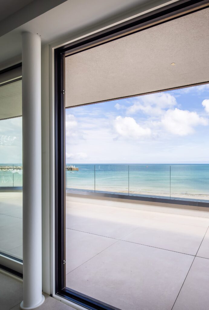 technal confort160 sliding glass door seafront hotel balcony view sliding doors trinity windows jersey 2500