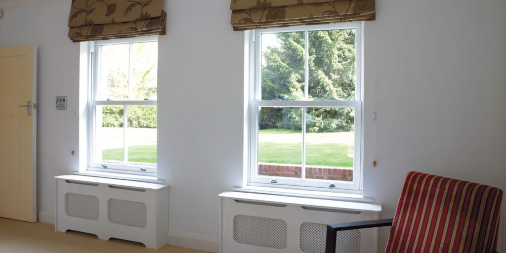 white upvc sash windows lounge interior traditional historic style trinity windows jersey 2500